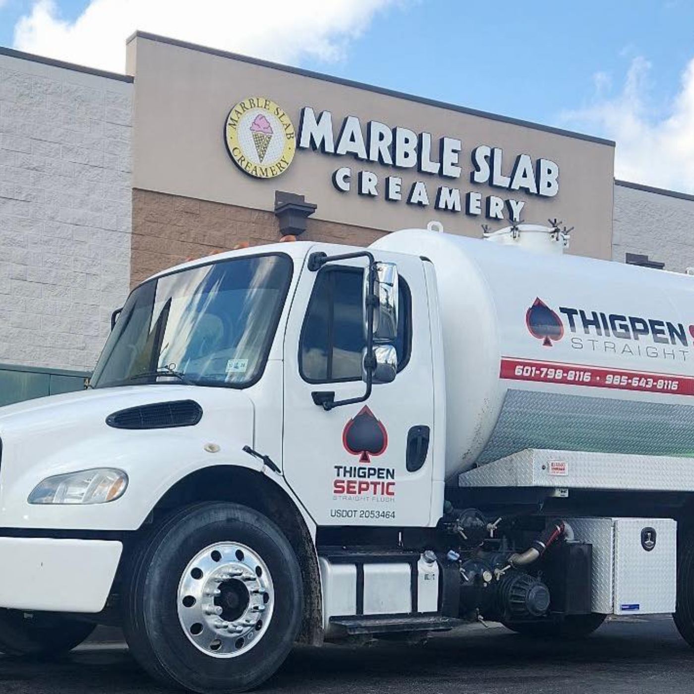 Pump truck servicing a commercial property
