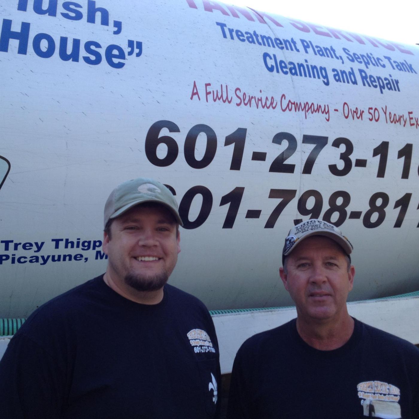Father and son of the Thigpen family in front of a Thigpen Septic truck